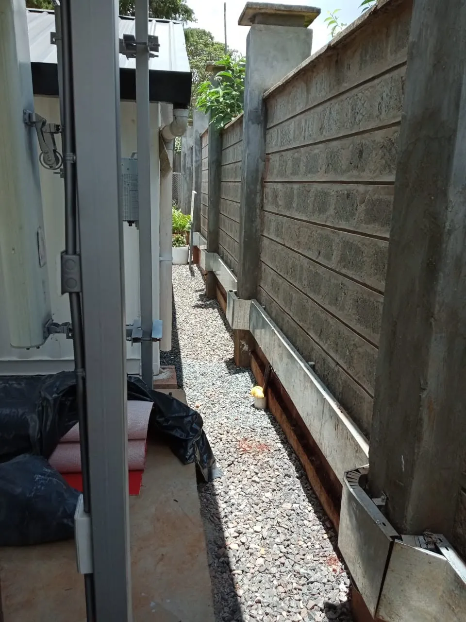 Galvanised cable trunking running along a perimeter wall