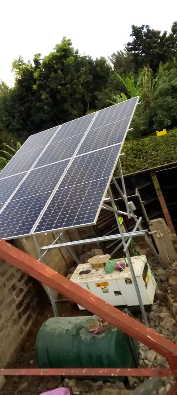 Ground-mounted solar panels above a canopy generator and fuel tank